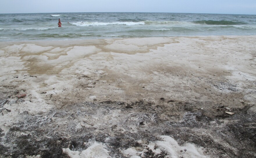Oil stains the sand in Orange Beach, Ala., in 2010, after the Deepwater Horizon oil rig exploded in the Gulf of Mexico, unleashing the largest offshore oil disaster in U.S. history.