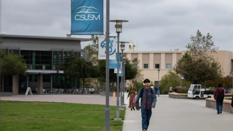 Students walk through campus at Cal State San Marcos on May 6, 2025.