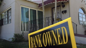 A bank-owned sign is seen in front of a foreclosed home in Miami. Florida was among the hardest hit states in the real estate collapse.