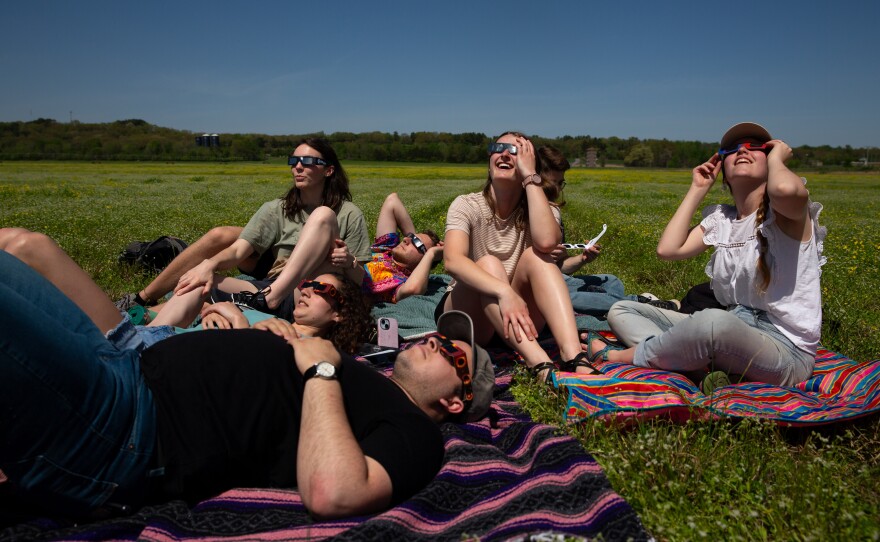 Marianna Davenport, Jada Trice, David Price, Brinson Davenport, Kassie Lamoureux, Landon Gardner, and Hannah Noble watch the eclipse in Searcy, Ark.