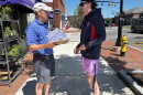 Maine Senate hopeful, Democrat David Costello, speaks with a potential voter as he gathers signatures, required to be considered at the party's convention, in downtown Brunswick, Maine on July 12.