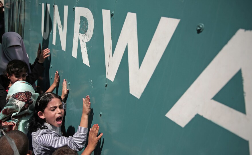 A Palestinian schoolgirl protests against a funding gap at the U.N. Relief and Works Agency in Gaza City, in 2015.