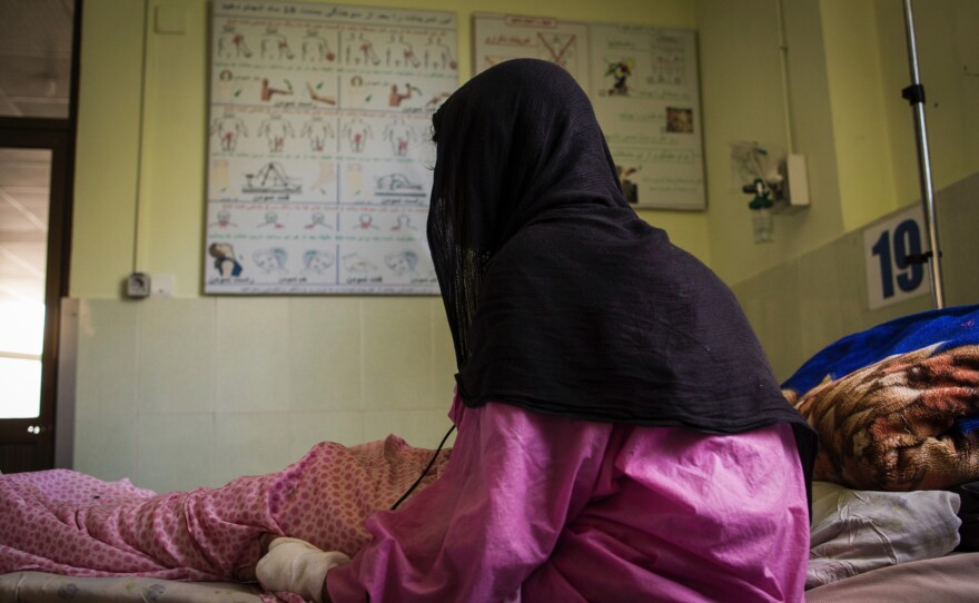 This photograph shows a patient at the Herat burn center in 2017. A mother of five, she says her husband set her on fire using kerosene while she was sleeping.