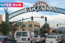 Cars drive beneath the El Cajon sign on Nov. 15, 2016 with Voter Hub overlay.