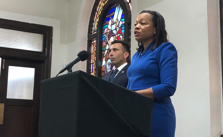 Assistant Attorney General of the U.S. Department of Justice's Civil Rights Division Kristen Clarke (right) speaks next to U.S. Attorney Martin Estrada, of the California central division, while announcing the redlining case against City National Bank during a news conference on Thursday at the Second Baptist Church in Los Angeles.