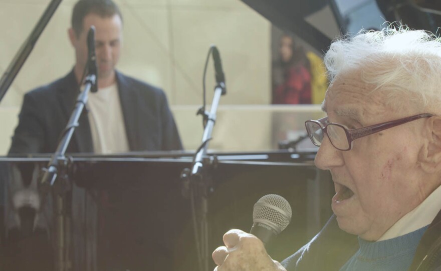 With his grandson Avi at the piano, David “Saba” Wisnia performs a song during a concert at the Polin Museum of the History of Polish Jews in Warsaw.