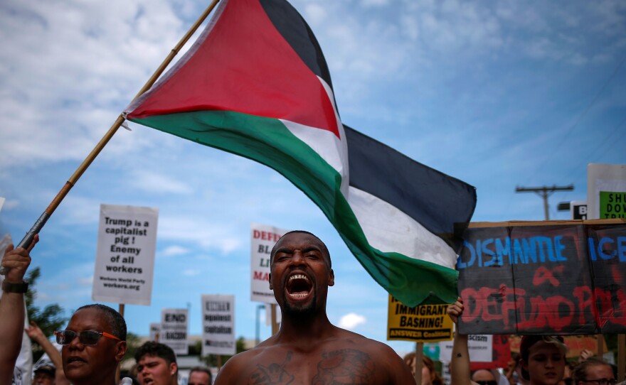 Demonstrators wave the Palestinian flag and chant "Black Lives Matter," among other slogans, during a march ahead of the Republican National Convention in Cleveland in 2016.