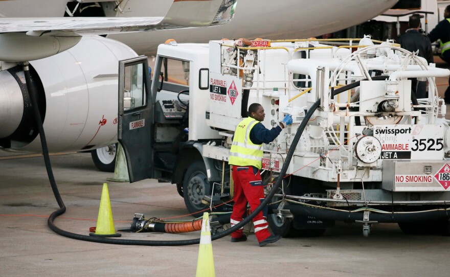 Prices for U.S. jet fuel have nearly doubled since before the Iran war began, shaking up the aviation industry. This file photo shows a worker preparing to fuel a United Express jet at Dallas-Fort Worth International Airport, in Grapevine, Texas.