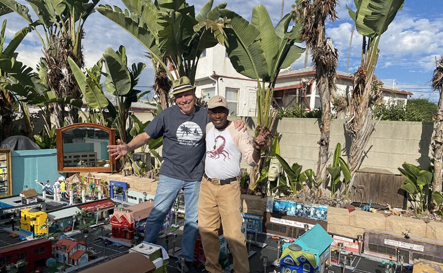 Host Ken Kramer joins Valencia Park resident Bernell Hopkins in Bernell's miniature city. San Diego, Calif.