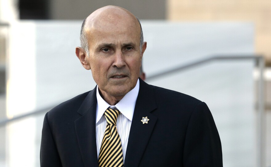 Former Los Angeles County Sheriff Lee Baca leaves federal court in Los Angeles, near the end of his December 2016 trial of charges of obstruction and conspiracy. A mis-trial was declared. Baca will be retried.