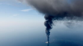 The Deepwater Horizon oil rig is seen burning on April 21 in the Gulf of Mexico. Federal investigators have turned their attention to the cementing process that occurred on the oil rig before the explosion.