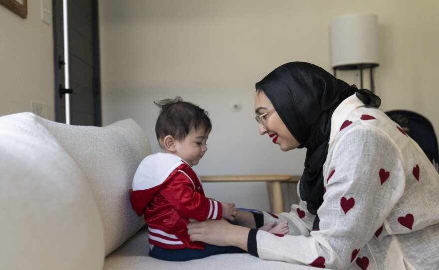 Sahar Pirzada and her son play in their Los Angeles home.