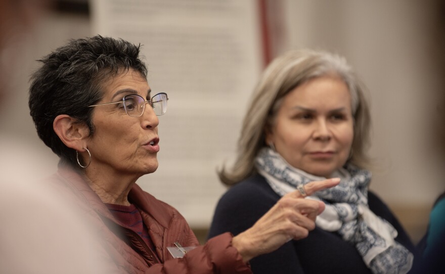 Norma Cázares discusses with other South Bay community leaders at the San Ysidro library on Tuesday, Feb. 20, 2024.