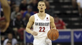 In this March 5, 2020, file photo, San Diego State's Malachi Flynn brings the ball up against Air Force during the second half of a Mountain West Conference tournament NCAA college basketball game in Las Vegas. 