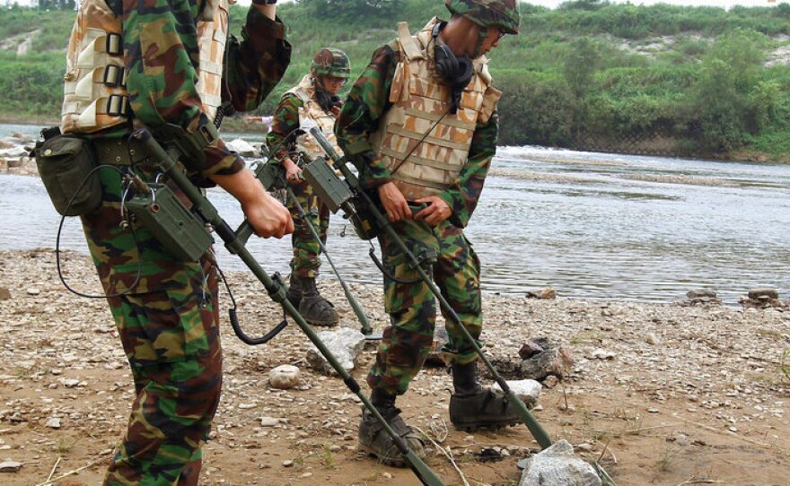 South Korean Army soldiers search for landmines in 2010 near the demilitarized zone that separates the two Koreas in Yeoncheon, north of Seoul, South Korea.