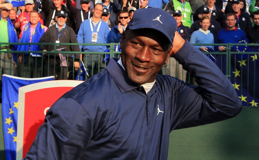 An on-brand Michael Jordan at the 2012 Ryder Cup, a few months after he sued Qiaodan Sports for the first time.