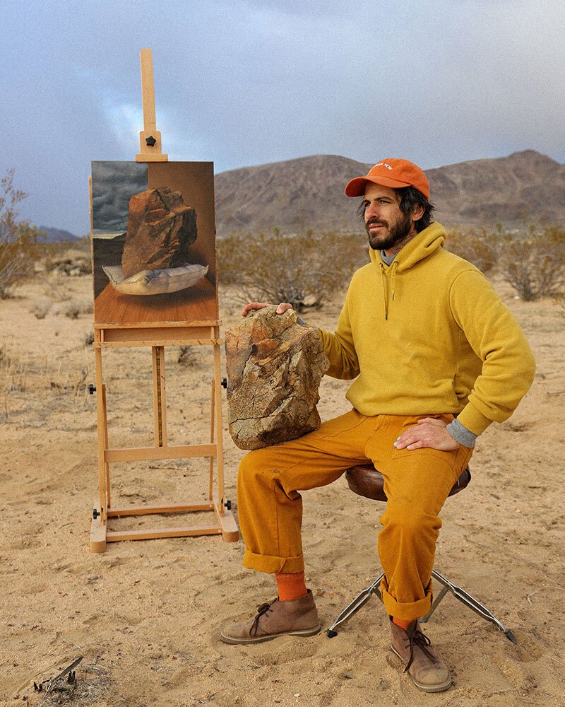 Artist Jonny Alexander is pictured with his painting, "Heavy Levity" (and the subject matter). The work will be on view at Swish Projects beginning Mar. 18, 2022.
