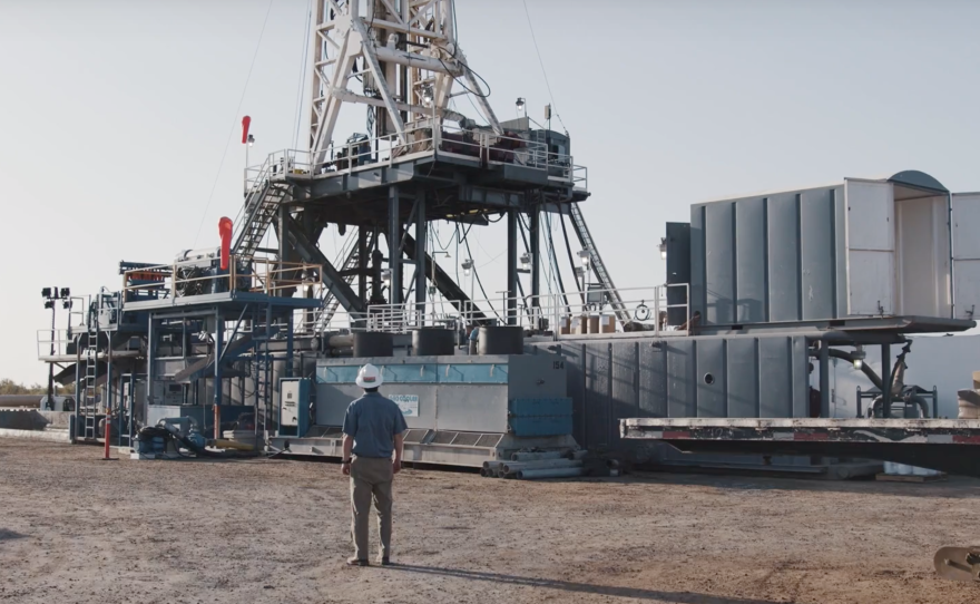 EnergySource Minerals executive Derek Benson, observes the company's' geothermal drilling rig at their Salton Sea location, where the company expects to also begin mining for lithium, in this undated photo.