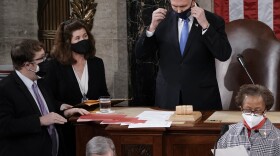 In this Jan. 6, 2021, photo, Senate Parliamentarian Elizabeth MacDonough, left, works beside Vice President Mike Pence during the certification of Electoral College ballots in the presidential election, in the House chamber at the Capitol in Washington. 