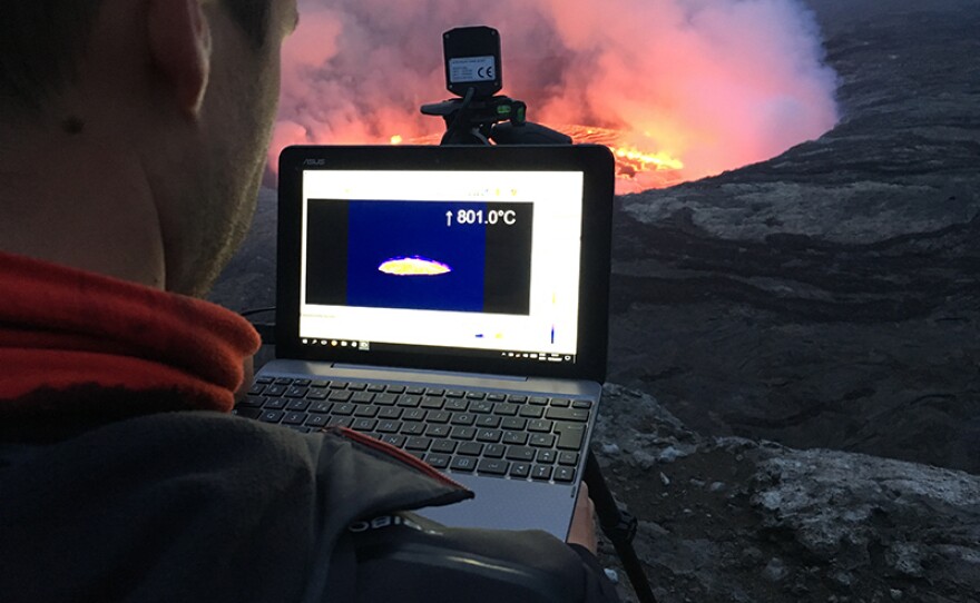 Expedition member Benoit Smets studying Nyiragongo's vast lava lake.  