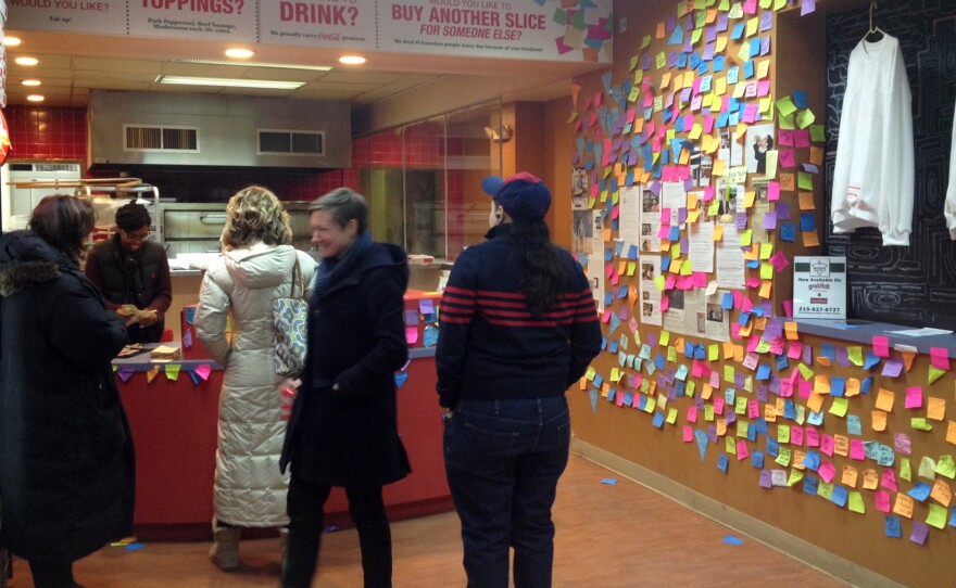 The lunchtime rush at Rosa's Fresh Pizza in Center City Philadelphia where customers pay extra money to buy slices for the homeless.