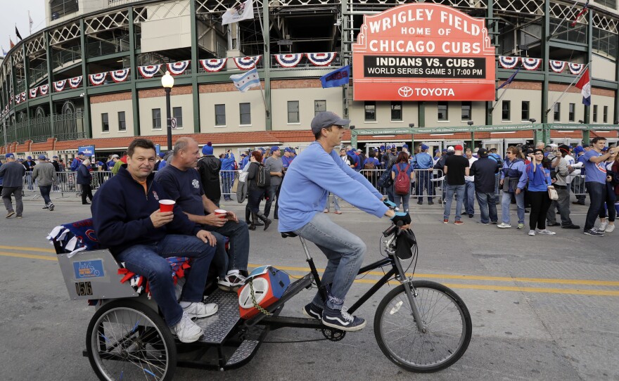 Fans arrive at Wrigley Field Friday before Game 3 of the World Series between the Chicago Cubs and the Cleveland Indians.