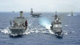 The Military Sealift Command fleet replenishment oiler USNS Henry J. Kaiser (T-AO 187), left, delivers a 50-50 blend of advanced biofuels and traditional petroleum-based fuel to the guided-missile cruiser USS Princeton (CG 59) during the Great Green Fleet demonstration portion of Rim of the Pacific (RIMPAC) 2012 exercise.