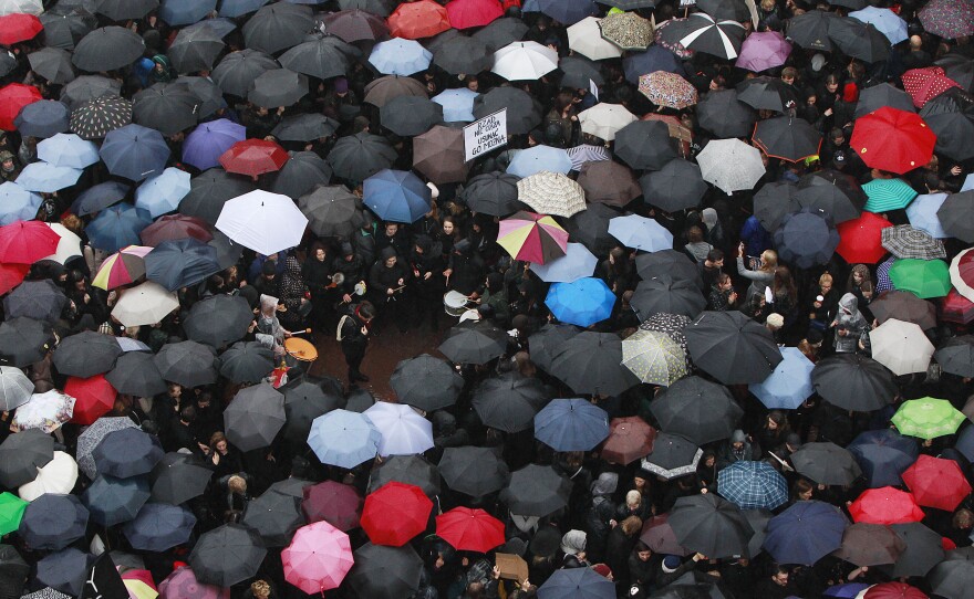 A sea of umbrellas fill downtown Castle Square in Warsaw, Poland, on Monday, as thousands of women and men participated in a nationwide "Black Monday" strike to protest a legislative proposal for a total ban on abortion.