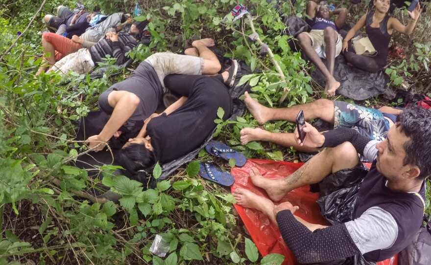 Migrants sleep on the ground in the Nicaraguan backcountry, waiting to continue their journey.
