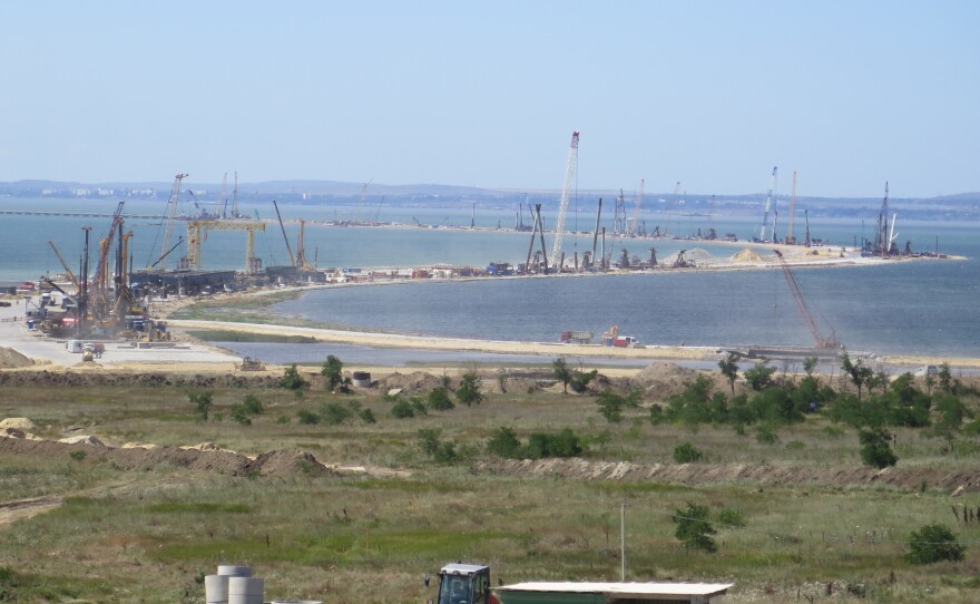 The zigzagging route of the Crimea Bridge, seen from the Russian side, bristles with cranes and construction equipment. The $4.3 billion project is expected to be finished in 2019.