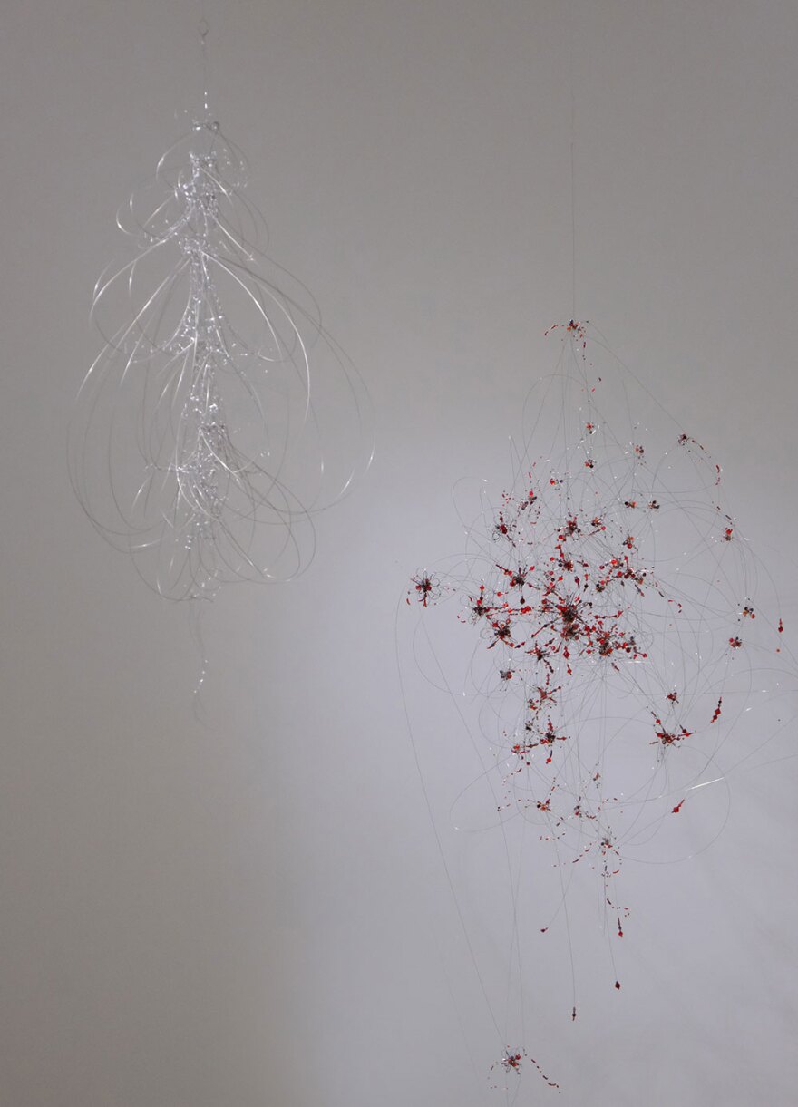 Anne Mudge's sculpture of stainless steel, beads and pigment, is shown installed at Quint Gallery on Apr. 20, 2023.
