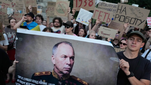 Activists hold a portrait of Ukraine's Armed Forces Commander-in-Chief Oleksandr Syrskyi demanding his resignation during a rally against President Volodymyr Zelenskyy's decision to dismiss Defense Minister Mykhailo Fedorov after six months in the post, in Kyiv, Ukraine, Saturday, July 18.