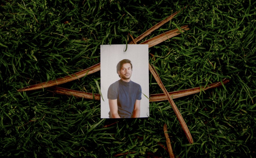 Self portrait, Washington Square Park, New York City, May 2022. Amir's Bengali nickname "Sobuj" means green, like the color of the grass that frames his photo.