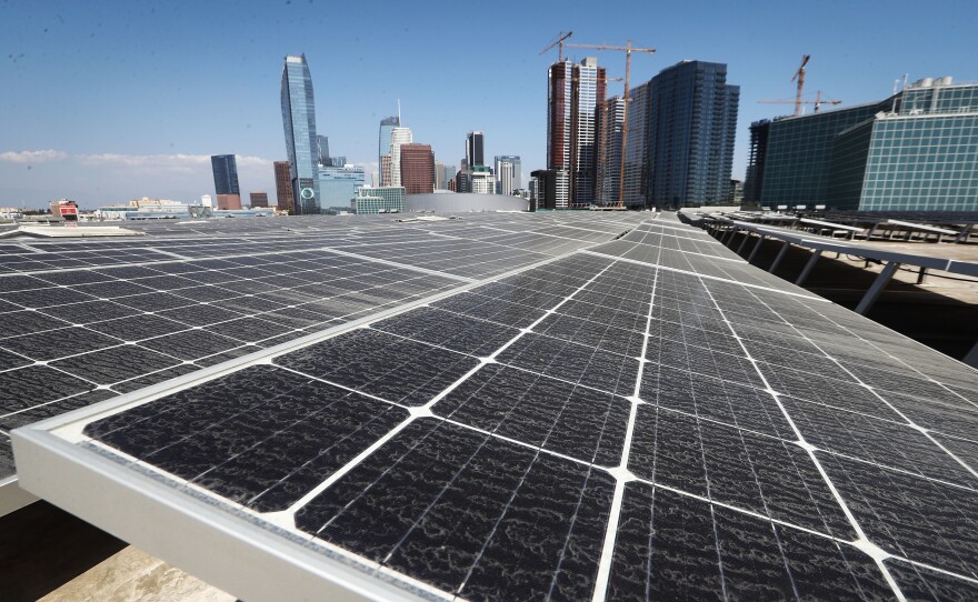 Solar panels are mounted on the roof of the Los Angeles Convention Center on September 5. The state's governor has signed a landmark bill setting a goal of 100 percent clean energy for the state's electrical needs, by the year 2045.