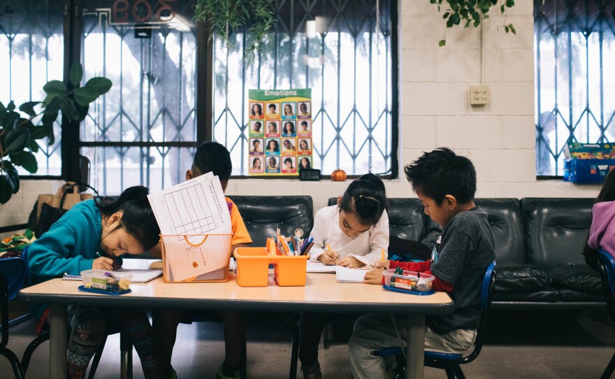 Students at Las Familias Del Pueblo, an after-school program in Los Angeles, practice sentence structure and language.