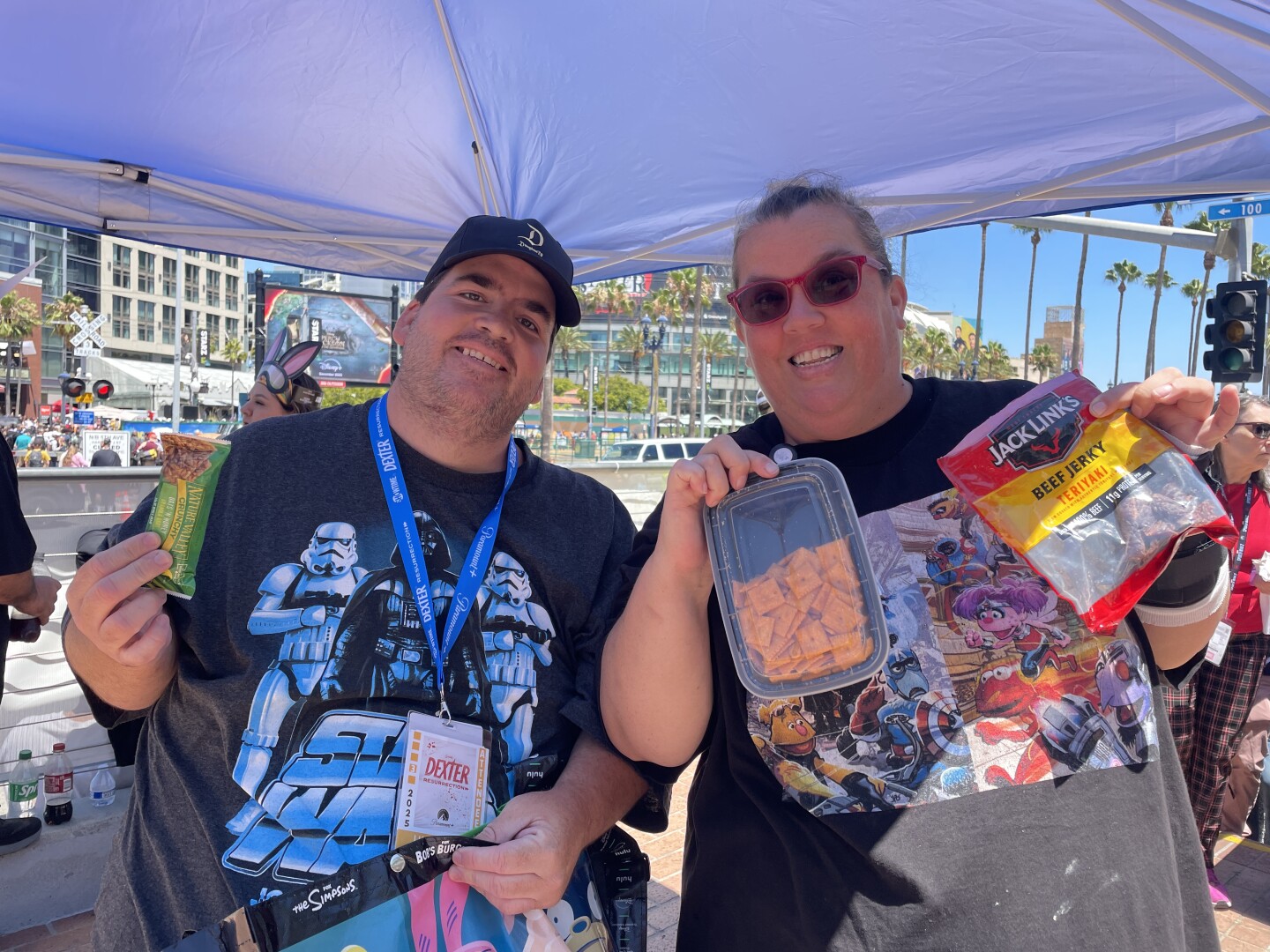 Local Comic-Con attendees Alex Tuttle and Jason Houck pose with their survival snacks. “Cheeze-Its and beef jerky,” Tuttle said. The classics.