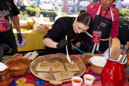 Image of a chef putting on a dishes final touches