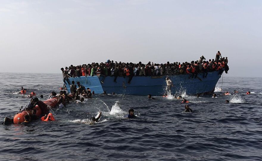 Migrants wait to be rescued earlier this month by members of Proactiva Open Arms NGO in the Mediterranean Sea, some 12 nautical miles north of Libya.