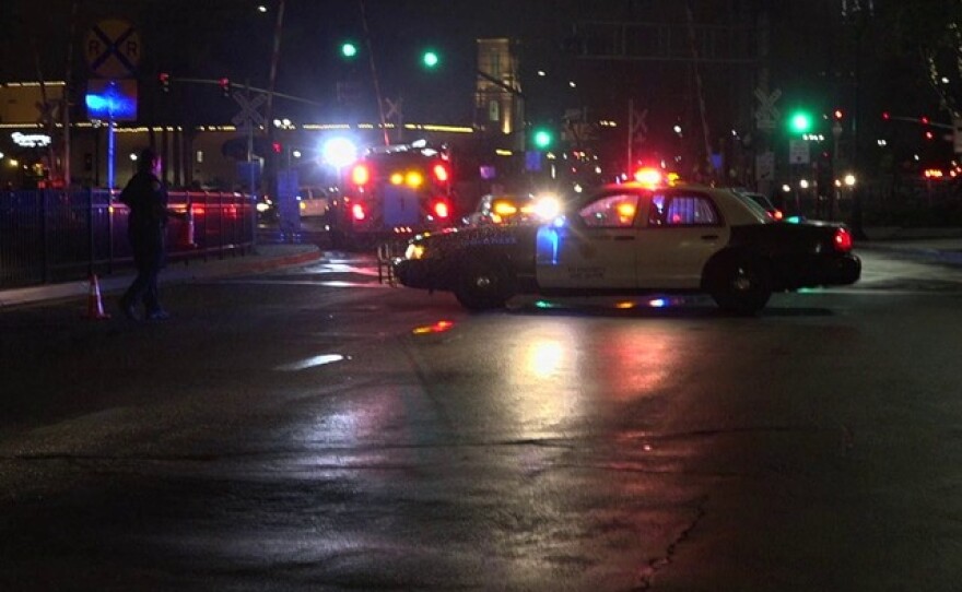 Authorities respond to the scene where a man was hit and killed by a Burlington Northern Santa Fe freight train in downtown San Diego, June 10, 2015.