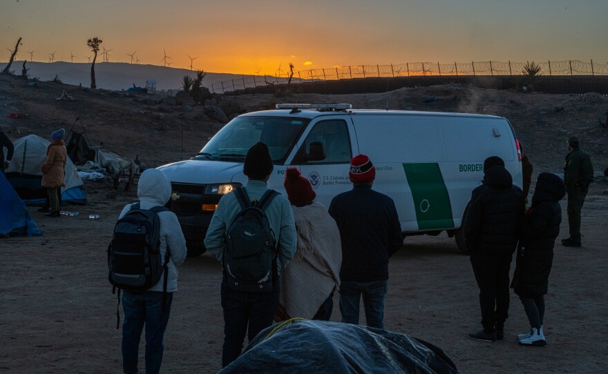 Would-be asylum seekers await processing by Border Patrol agents.