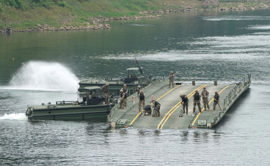 U.S. Army soldiers try to dismantle a floating bridge during a training exercise on a river in Yeoncheon, South Korea, near the border with North Korea, Thursday, Aug. 20, 2026.