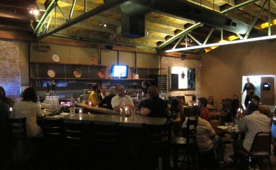 The darkly cool industrial interior of El Take it Easy in North Park.