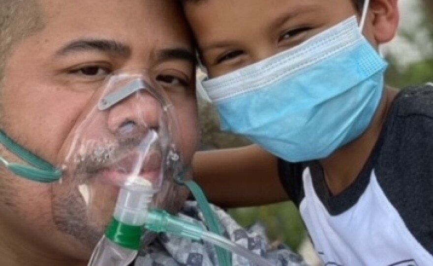 Vezna Hang and his son, visiting outside the hospital in spring 2021.
