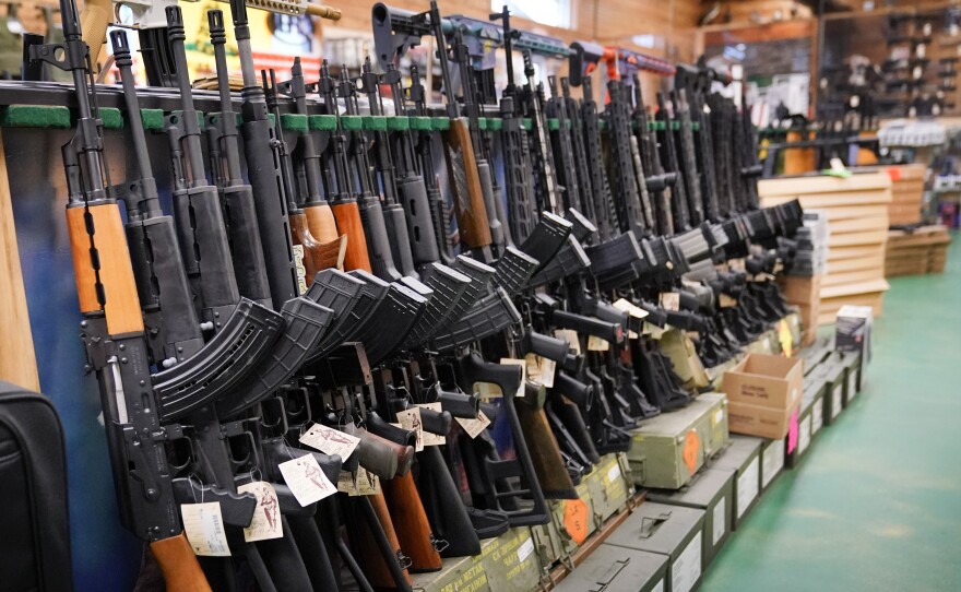 Semi-automatic rifles are displayed at Coastal Trading and Pawn, Monday, July 18, 2022, in Auburn, Maine.