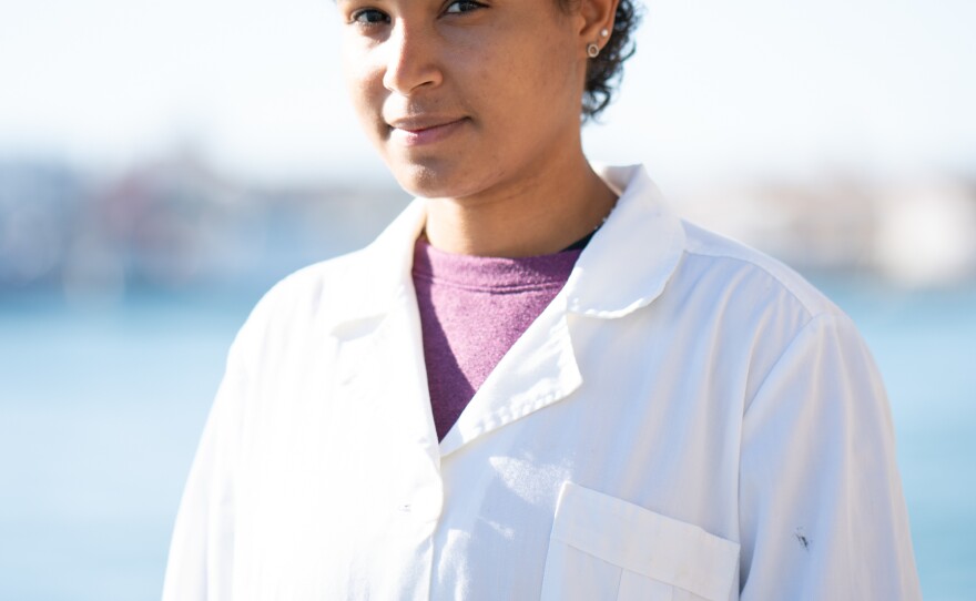 Manon Museux, 22, works as an intern with the quality control of the fish coming into the port in Peniche, Portugal.