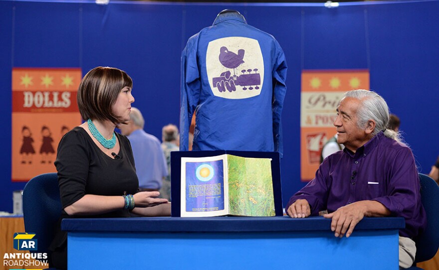 Laura Woolley (left) appraises a 1969 Woodstock jacket and program in Albuquerque, N.M. ANTIQUES ROADSHOW RECUT “American Stories, Part 1” premieres Monday, July 12, 2021 at 9/8C p.m. on PBS.