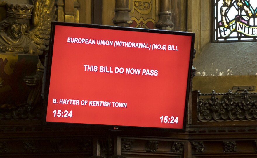 A monitor in the House of Lords shows its approval of a bill blocking a no-deal Brexit Friday.