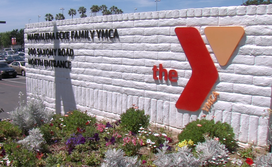 A sign is shown in front of the Magdalena Ecke YMCA in Encinitas, May 2015.