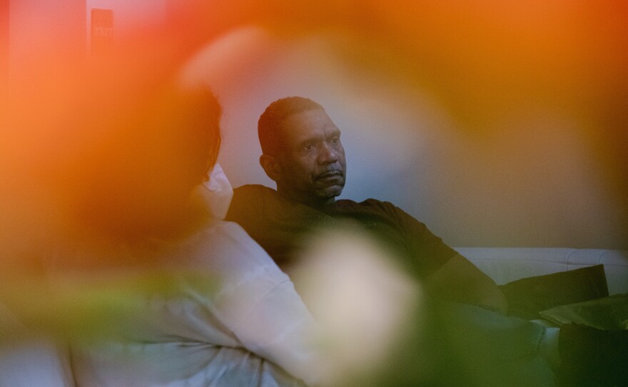 Tyrone Ferrens contemplates as he speaks to NPR reporters in his house in Aberdeen, Md.