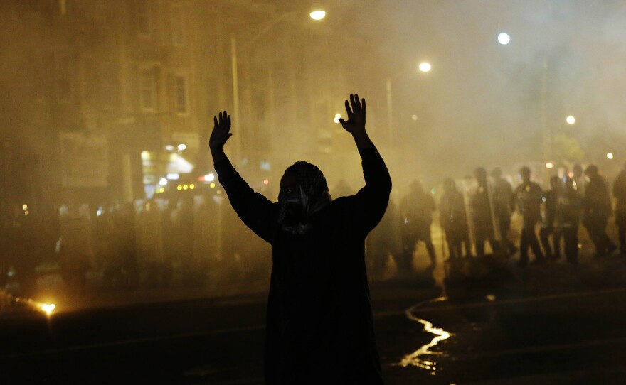 What do you see in this image? An 'uprising' or a 'riot'?